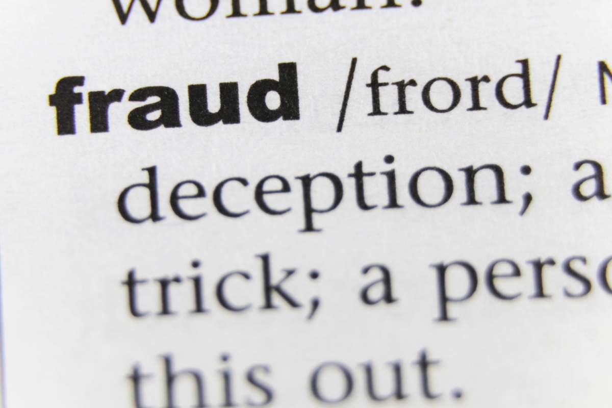 Image of dictionary entry for Fraud; Shutterstock.